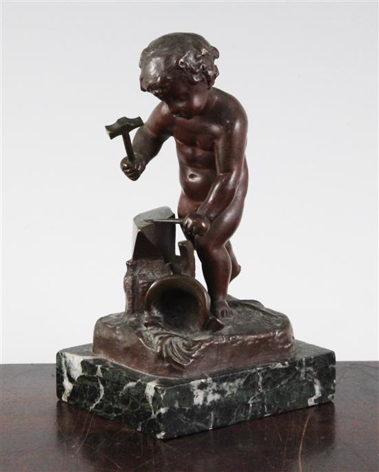 Henri Capy. A bronze figure of a putto forging an arrow, 6in.